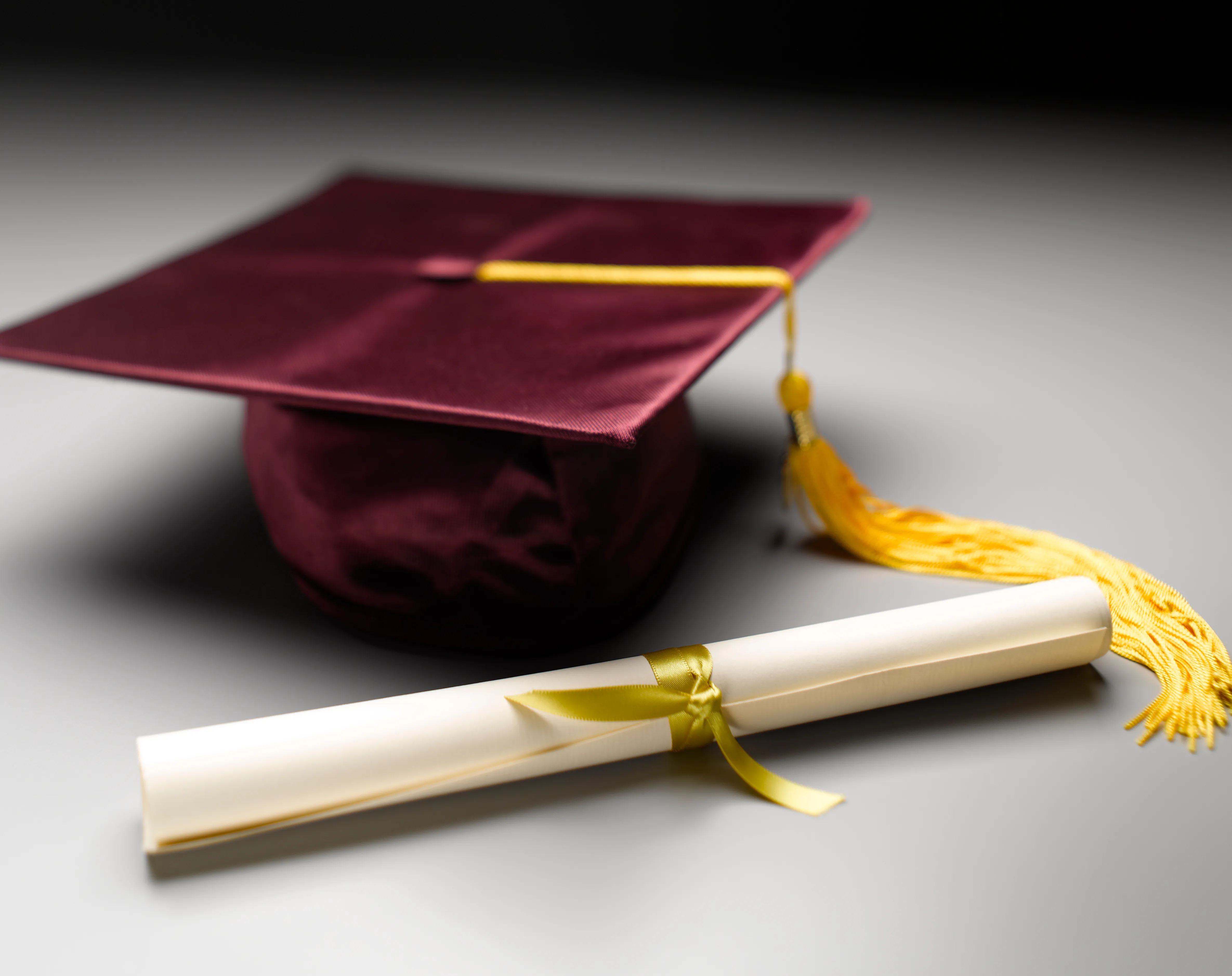 Graduation cap and diploma representing a Bachelor of Science degree.